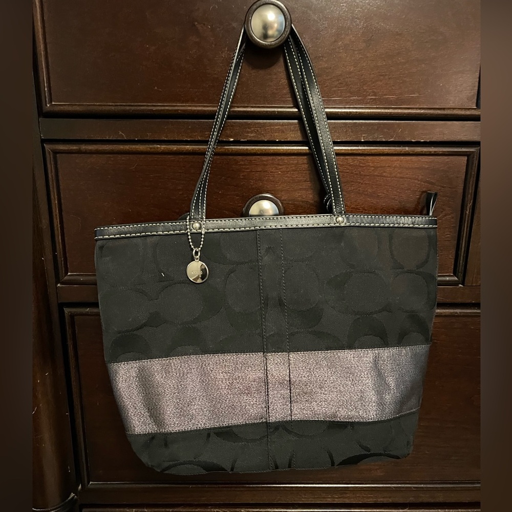 Coach black signature tote with metallic stripe